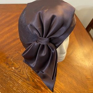 Purple hat with bow